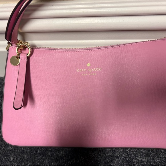 kate spade Handbags - Kate Spade Pink Wristlet with Gold Accents
